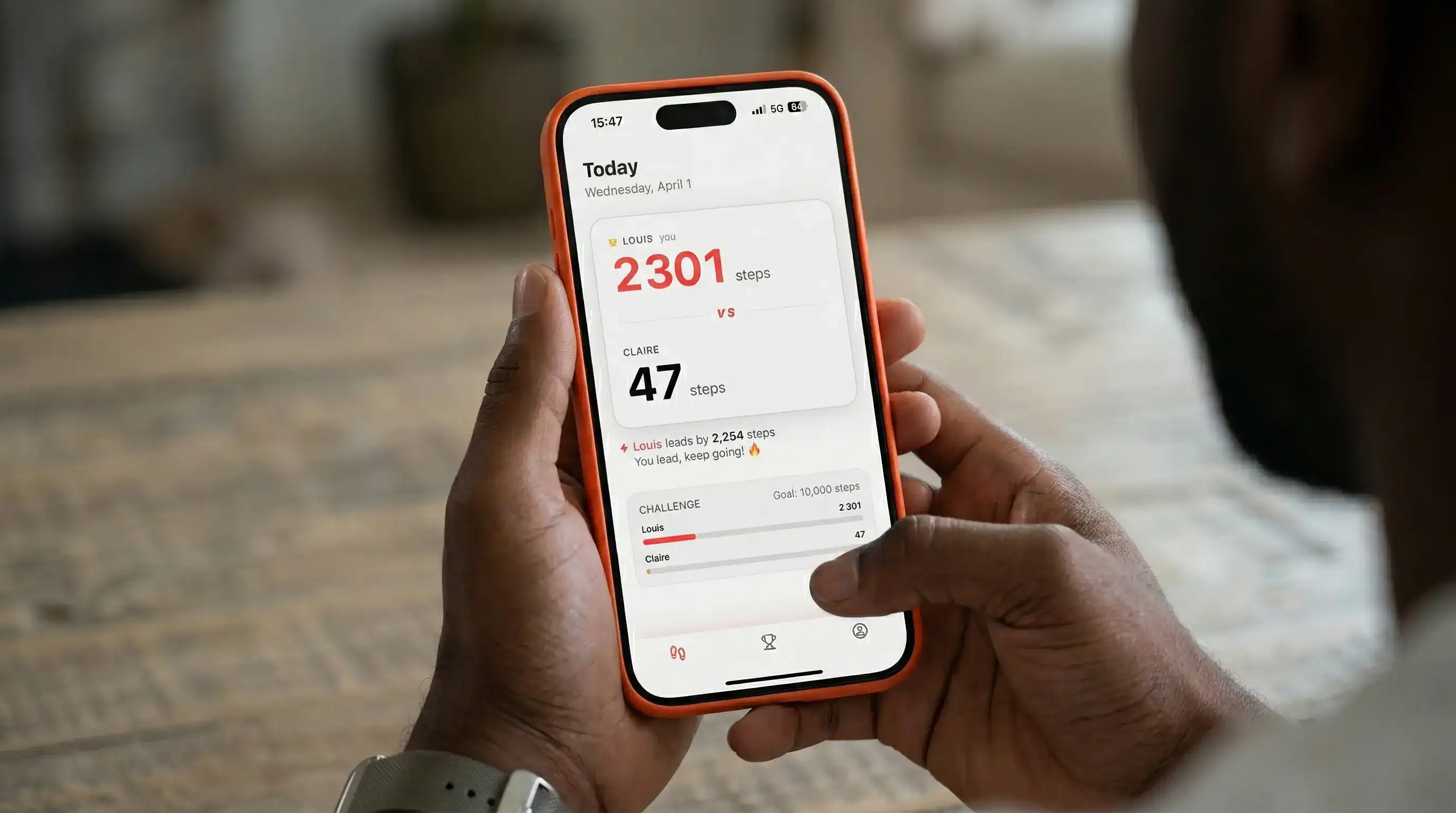 Steplee app on smartphone used to track steps and start a walking challenge with someone else
